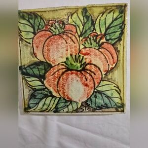 Handcrafted Ceramic Tile with Orange Floral Design